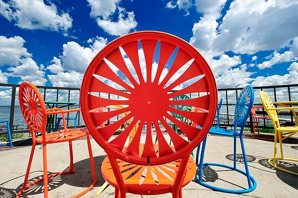 Puffy white cumulus clouds and a deep blue sky make for a striking view of Memorial Union Terrace chairs at the University of Wisconsin-Madison on June 22, 2012. (Photo by Bryce Richter / UW-Madison)